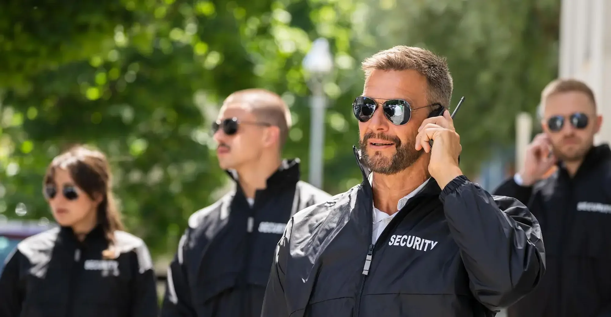 Two personal security officers coordinating outdoors in Washington, D.C.