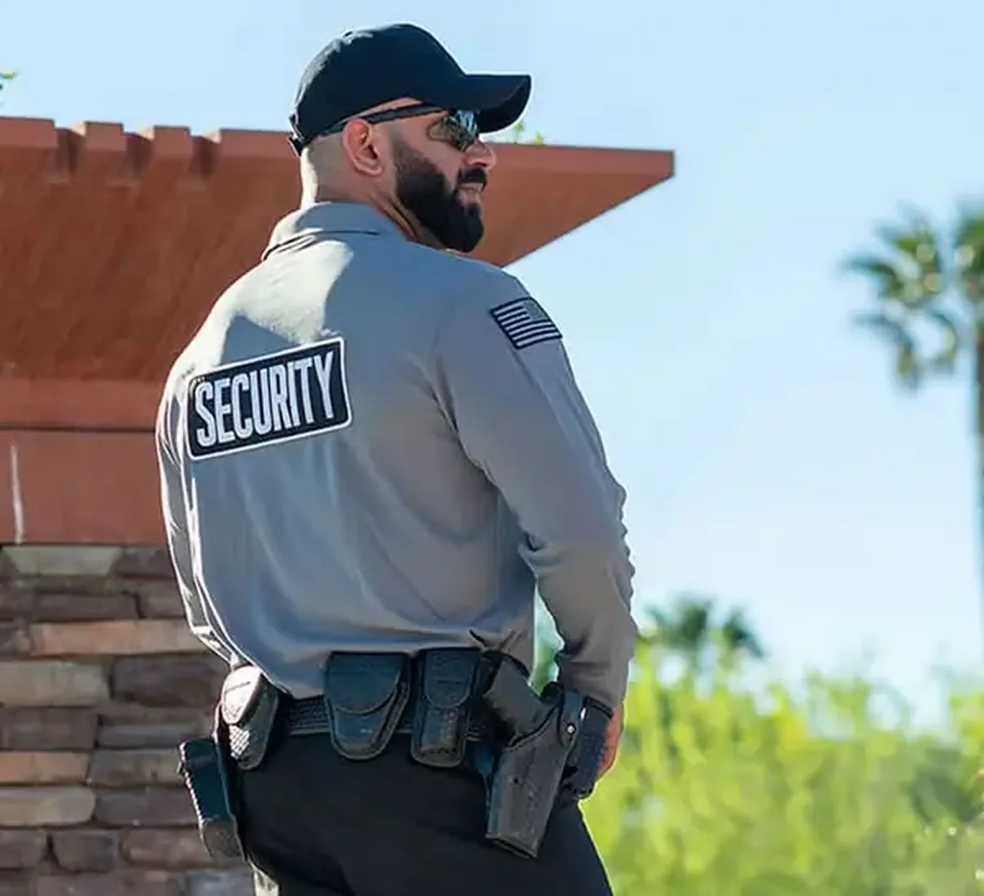 Uniformed security officer on duty at a business event entrance