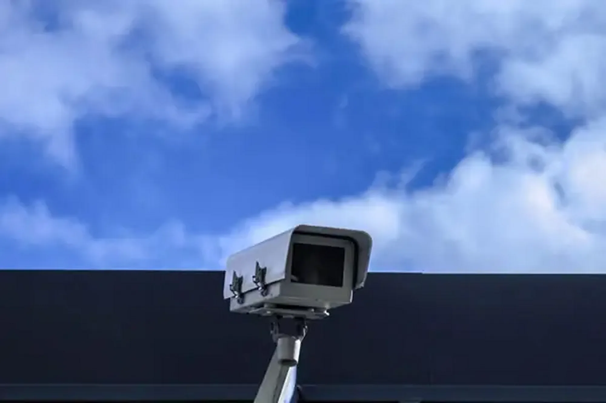 Security operations center displaying integrated CCTV and AI monitoring feeds