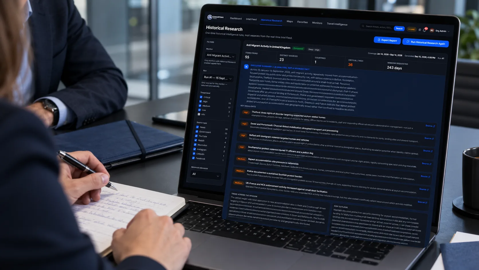 An analyst takes handwritten notes beside a laptop showing the Samaritan Vigil™ Historical Research view, with an executive summary, key highlights rated by threat level, and source-type filters for a completed historical intelligence run.